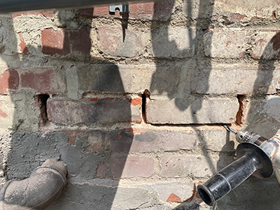 urm building structural testing process removing grout